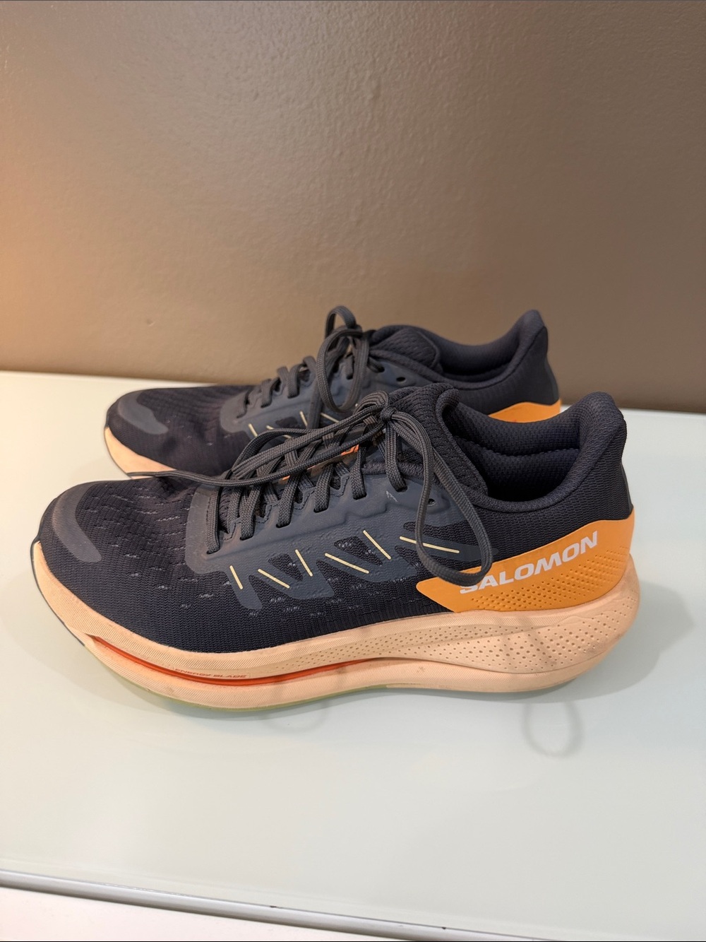 Salomon women’s Navy and Peach Athletic Running Shoes/7.5